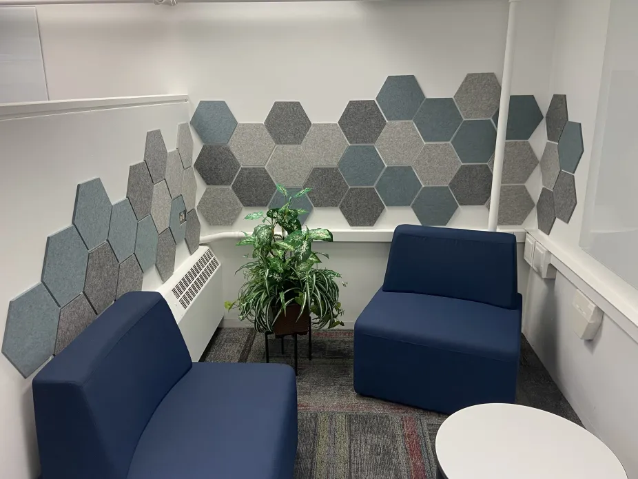 Library carrel with soft seating and decorative tiles
