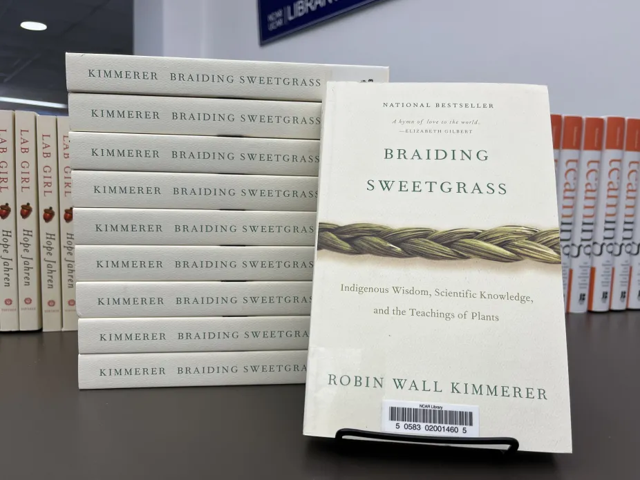 Stack of books: "Braiding Sweetgrass" by Robin Wall Kimmerer